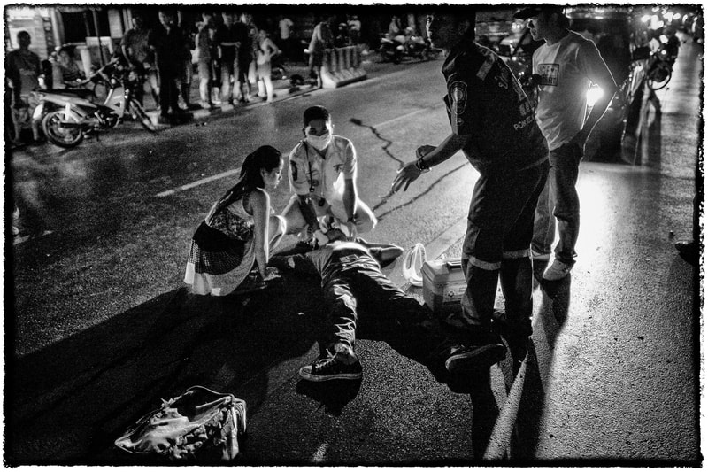 A Bangkok accident victim waits for treatment