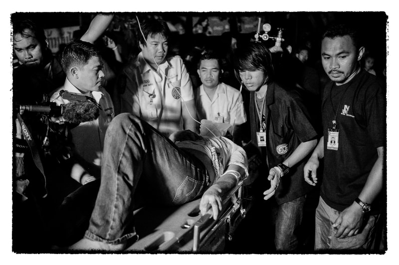 Bangkok accident victim is treated by volunteers and paramedics