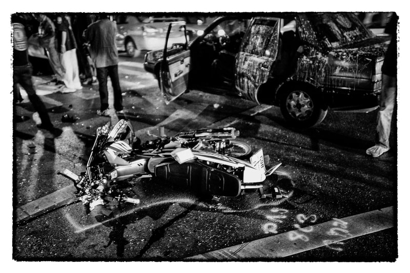 The motorcycle of a fatal accident victim on the street in Bangkok