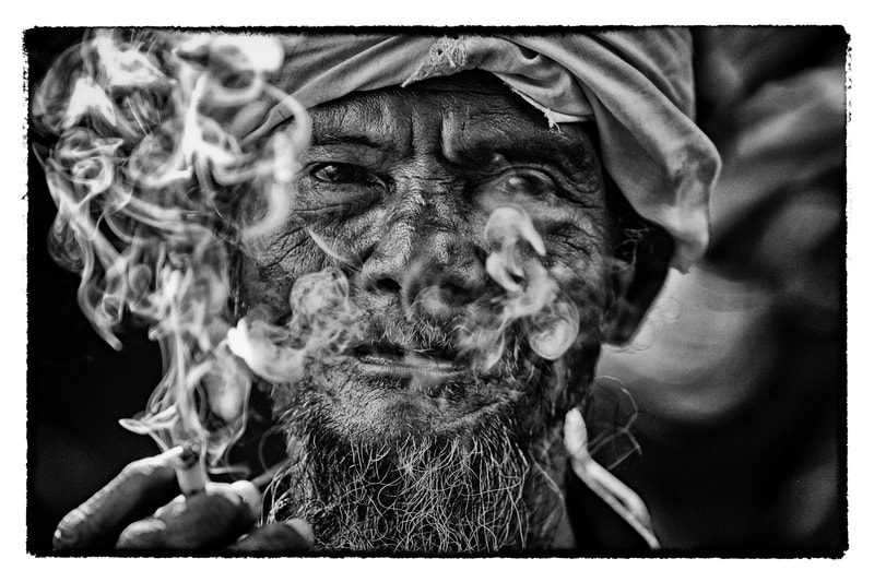 Indonesia man smokes
